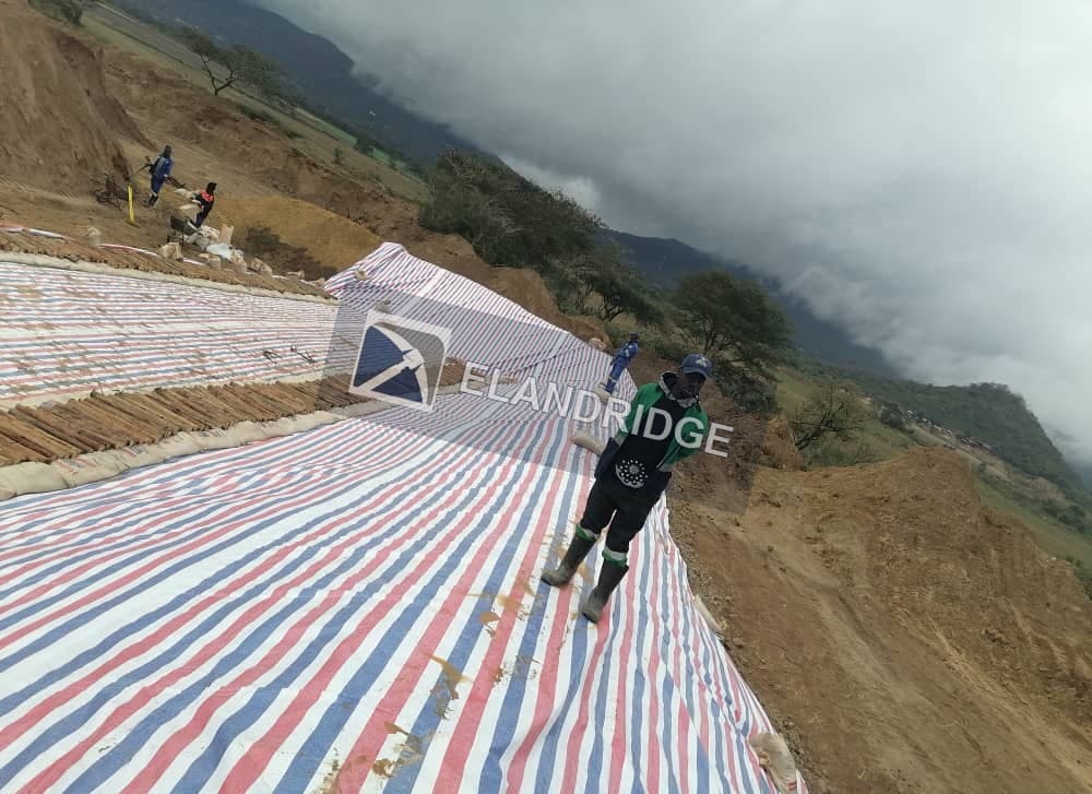 Heap leach pad liner laid on the slope